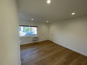 Los Angeles apartment for rent - a living room with wooden floors and a window
