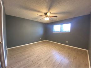 Atwater house for rent - a empty room with a ceiling fan and a window