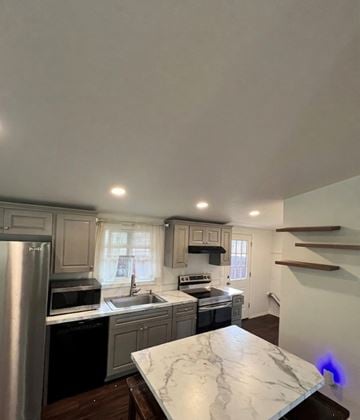 Castle Rock apartment for rent - A kitchen with a marble counter top and stainless steel appliances.