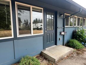 Castle Rock apartment for rent - A blue house with a black door and a mailbox on the right side.