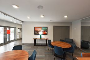 Chattanooga townhouse for rent - A modern dining area with a wooden table surrounded by chairs.