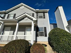 Greer house for rent - a white house with a blue sky behind it