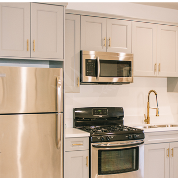 Los Angeles apartment for rent - a kitchen with stainless steel appliances and white cabinets