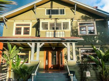Los Angeles apartment for rent - the front of a yellow house with a porch