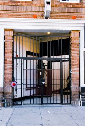 Los Angeles apartment for rent - A black gate with a red circle and white line on it.