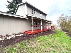 Kelso house for rent - a white house with a red porch in the grass