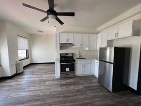 Los Angeles apartment for rent - A kitchen with a refrigerator, oven, and microwave.