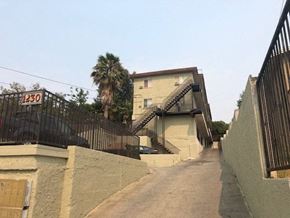 Los Angeles apartment for rent - A house numbered 130 with a staircase leading to the front door.