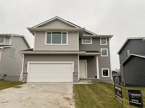Urbandale house for rent - a house with a garage door in front of it