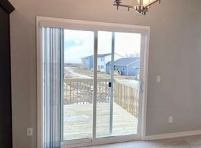 Urbandale house for rent - a sliding glass door with a view of a deck