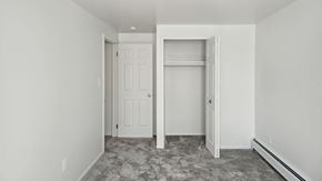 Pontiac apartment for rent - a bedroom with a closet and a door to a closet