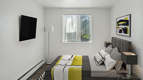 Pontiac apartment for rent - a bedroom with a bed and a window