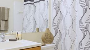 Pontiac apartment for rent - a bathroom with a shower curtain and a sink