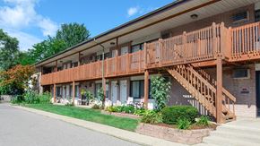 Pontiac apartment for rent - a view of the front of a building with wooden stairs