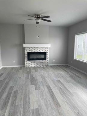 Urbandale house for rent - a living room with a fireplace and a wooden floor