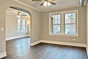 Oak Park apartment for rent - A room with a ceiling fan and two windows.