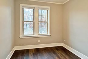 Oak Park apartment for rent - A room with a window and wooden floors.