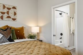 Jeffersonville apartment for rent - a bedroom with a bed and an open door to the bathroom