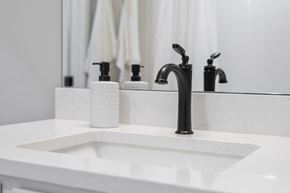 Jeffersonville apartment for rent - a white sink with a black faucet in a bathroom