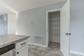 Shepherdsville house for rent - an empty kitchen with an empty closet in the corner