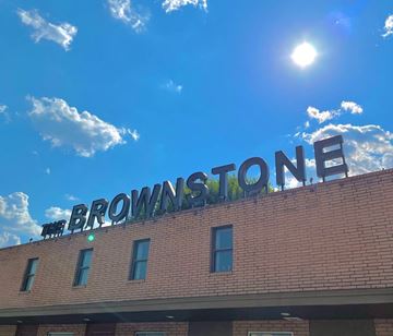San Antonio house for rent - The Browns Stone building has a red brick facade.