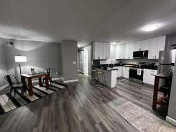 Trenton apartment for rent - A kitchen with a dining table and chairs.