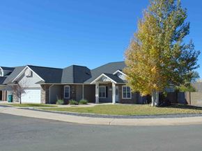 Show Low house for rent - a house on the corner of a street with a tree