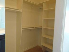 Show Low house for rent - a walk in closet with empty shelves in it