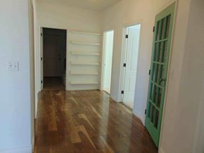 Show Low house for rent - a living room with wood floors and white walls and a green door