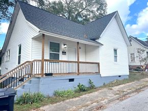 Anderson house for rent - a white house with a porch and a
