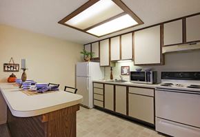 Titusville apartment for rent - A kitchen with a white counter and a white refrigerator.