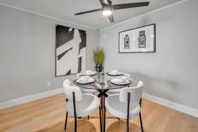 Melbourne apartment for rent - A dining room with a table set for two and two chairs.