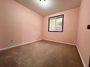 Longview house for rent - an empty room with carpet and a window