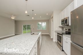 Palm Bay house for rent - a large kitchen with granite counter tops and stainless steel appliances