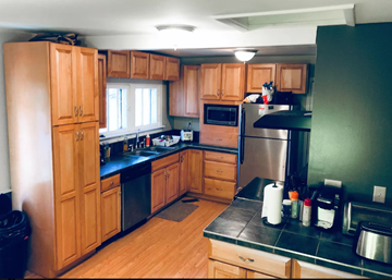 Ann Arbor apartment for rent - a kitchen with wooden cabinets and stainless steel appliances