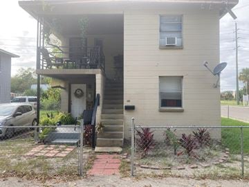 Jacksonville house for rent - the front of a house with a yard and a fence