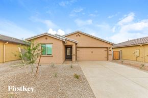Florence house for rent - a house with a driveway and a garage door
