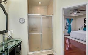 Washington house for rent - a bathroom with a shower and a sink and a bed