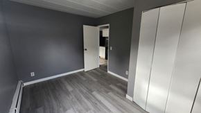 Cincinnati apartment for rent - A room with a grey wall and a white door.