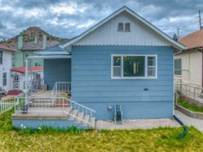 Trinidad house for rent - A blue house with a white door and windows.