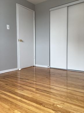 Brampton apartment for rent - an empty room with wooden floors and white doors