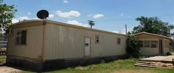 Littlefield house for rent - a mobile home with a satellite dish on the roof