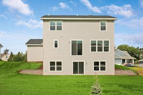 Hudson house for rent - the back of a house on a grassy hill
