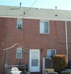 Clairton house for rent - a red brick building with a white door and window