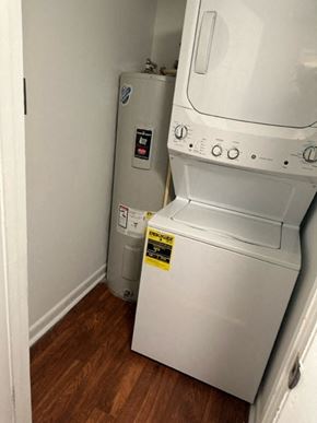 Fayetteville house for rent - A washing machine and a water heater in a small room.