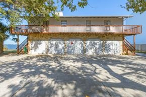 Palm Bay house for rent - the front of a house with a garage door and a balcony