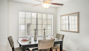 Moorpark apartment for rent - a dining room with a table and chairs and a ceiling fan