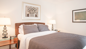Moorpark apartment for rent - a bedroom with a bed and a painting on the wall