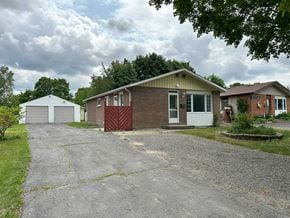 Trenton apartment for rent - A house with a driveway in front of it.