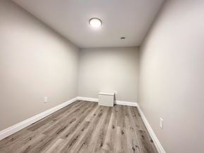 Trenton apartment for rent - A room with wooden flooring and a white box on the floor.